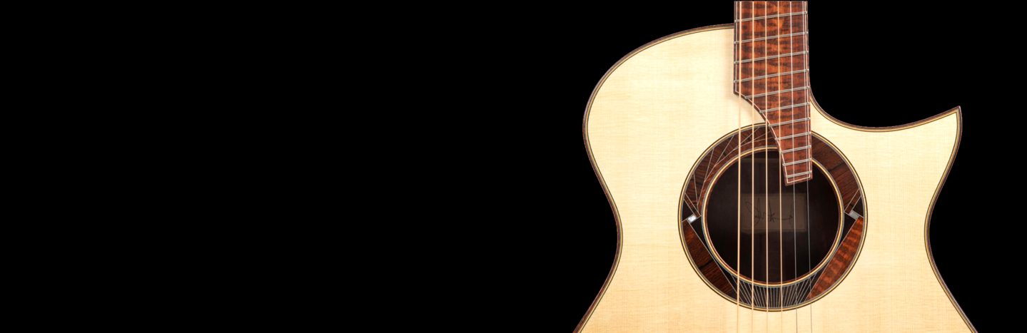 Guitar In Front of Black Background